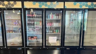 Commercial refrigerator with various drinks and food items