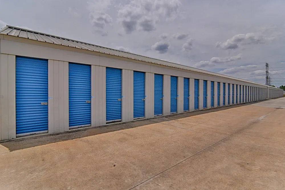 Aisle of small, outdoor drive-up storage units at My Storage.