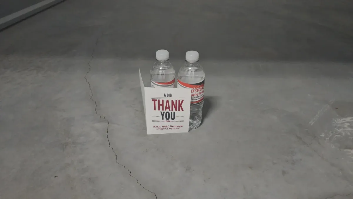 Thank you card and water bottles at the Dripping Springs storage facility