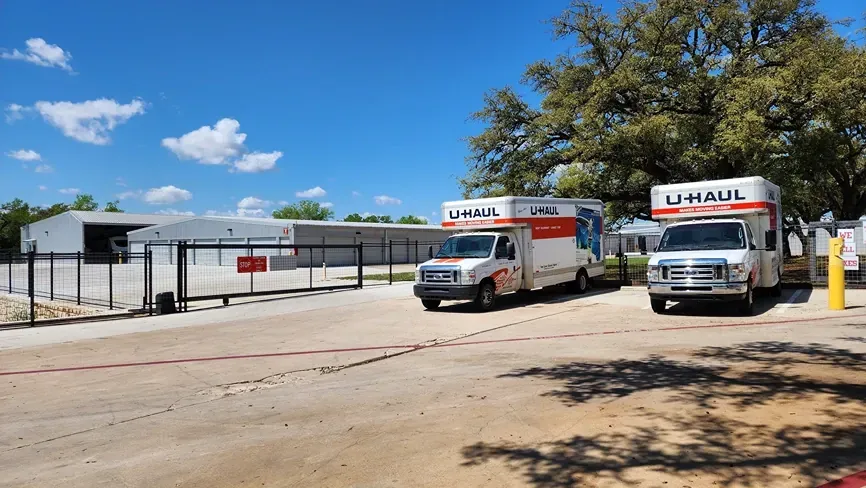 Uhaul trucks and gate at the Dripping Springs storage facility
