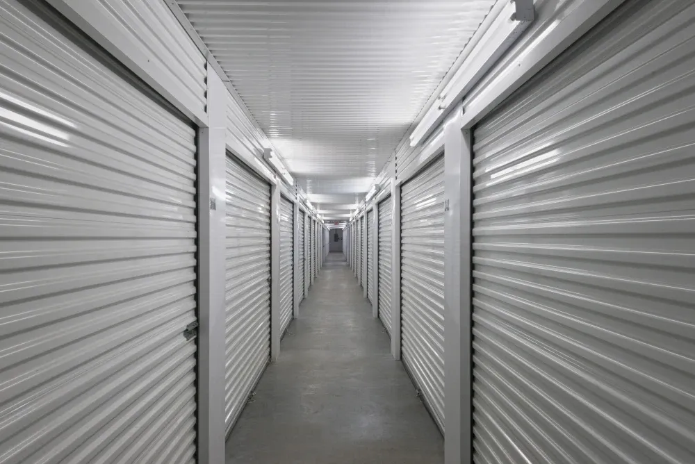 Aisle of indoor, climate-controlled storage units at AAA Self Storage.