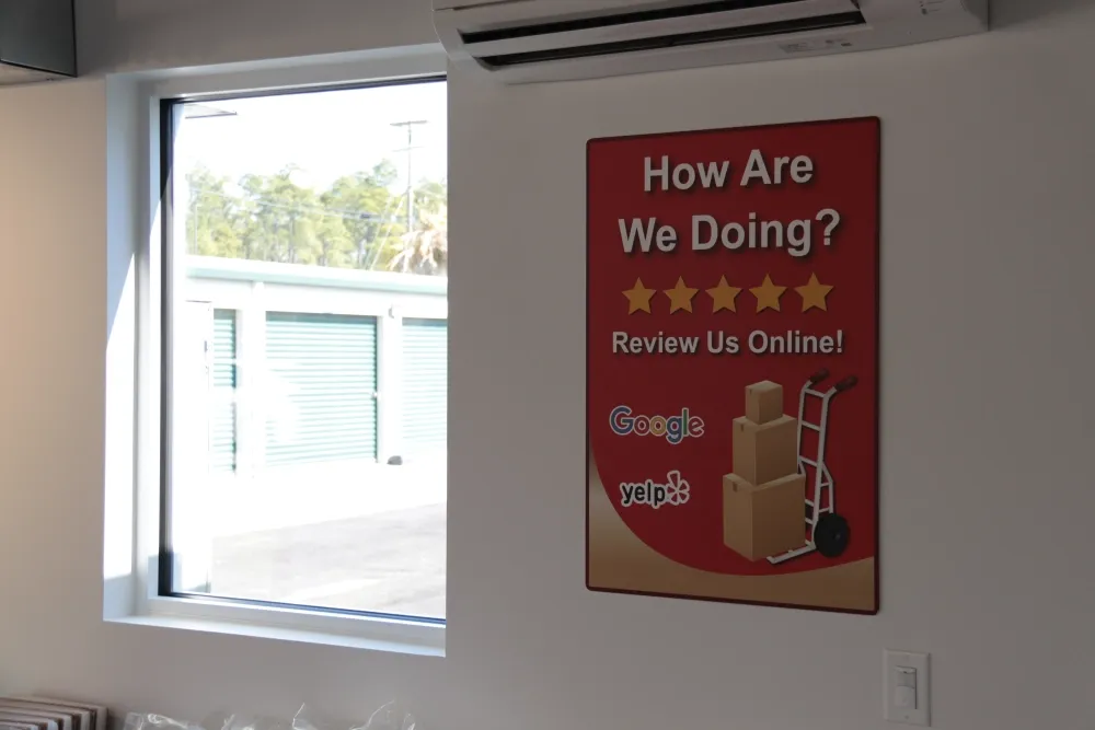 View of "how are we doing?" poster at Columbia Self Storage.