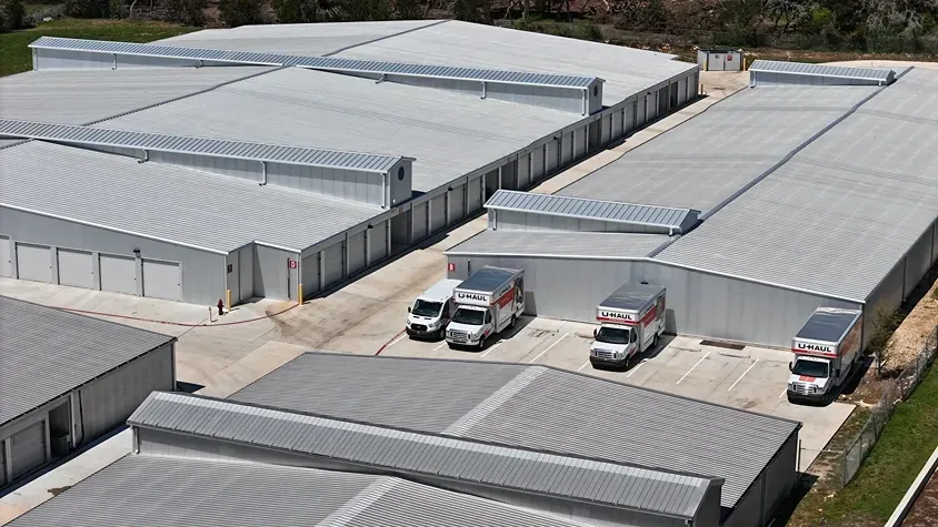 Trucks and self storage form above at the Dripping Springs storage facility