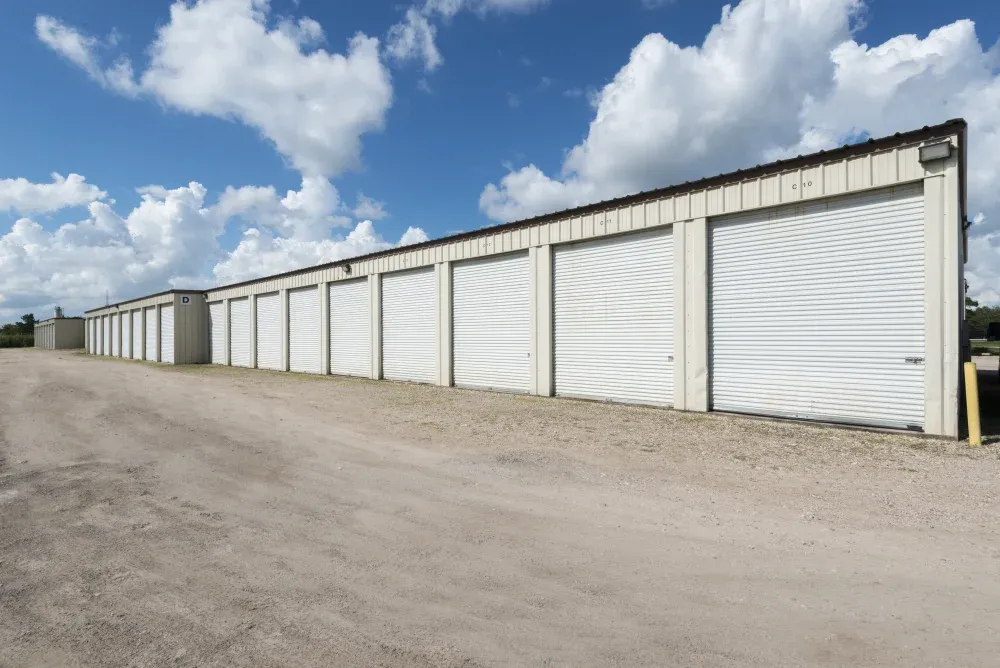 Outdoor storage units with roll-up doors and drive-up access at Guardian Storage.