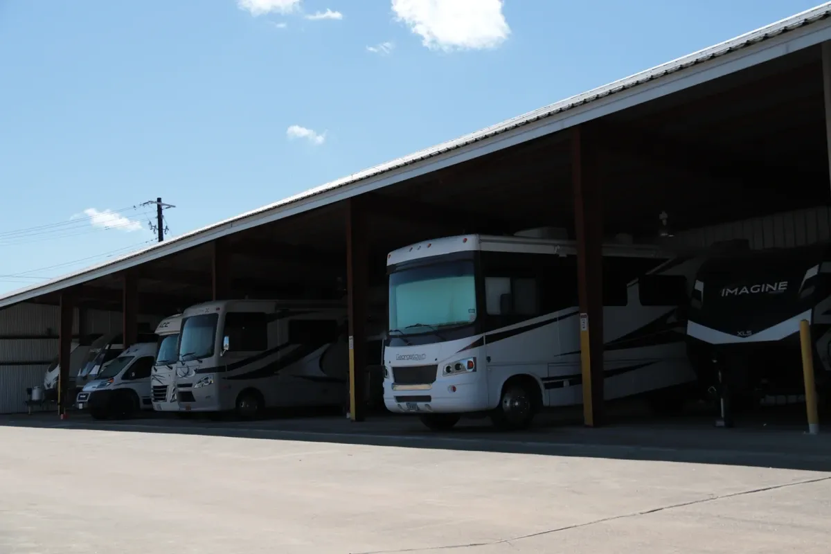 Campers under a storage awning at the Dripping Springs storage facility