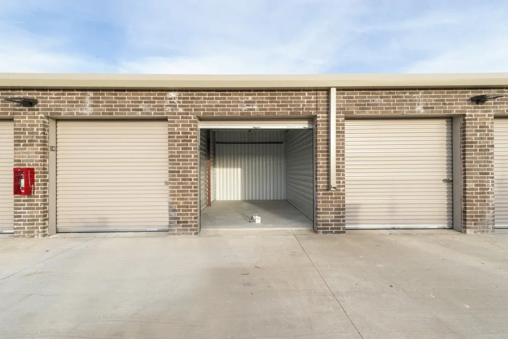 Outdoor, drive-up storage unit with roll-up door at Storage Center at Craig Ranch.
