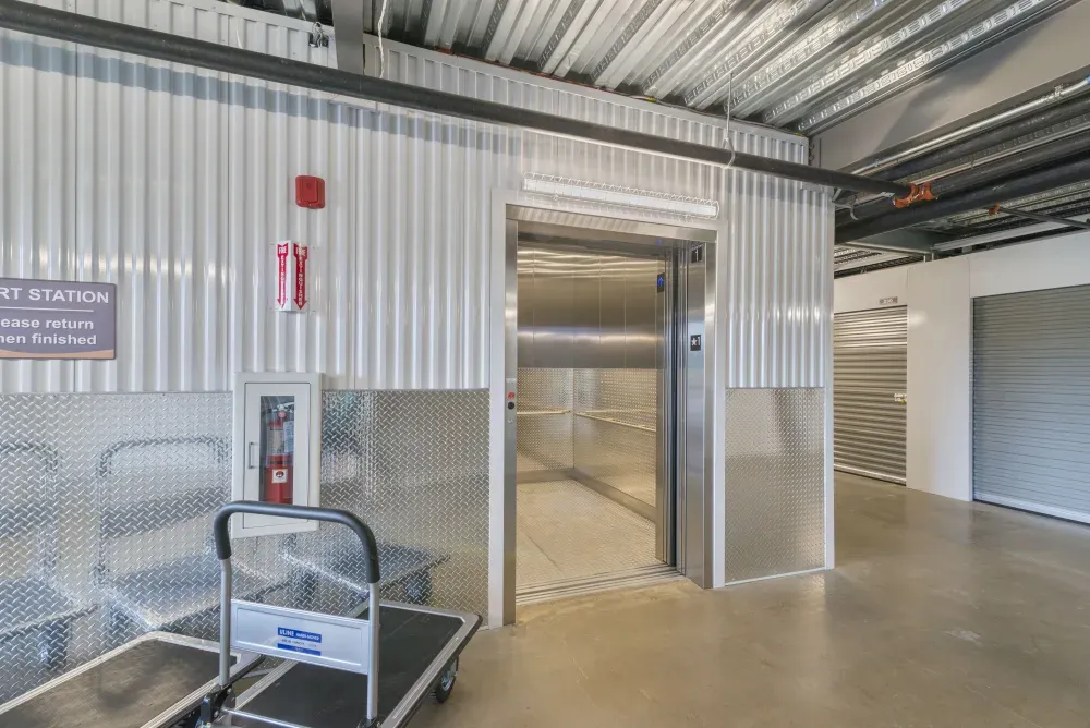 Indoor elevator and moving carts at Southlake Storage.