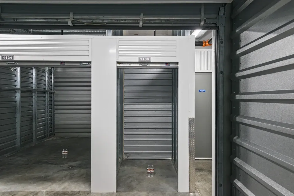Opened small, climate-controlled storage unit with roll-up doors at Valley Ranch Storage.