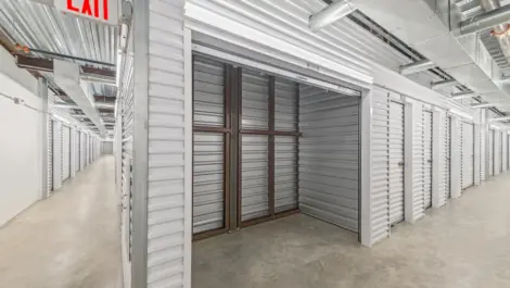 Opened indoor storage unit at Memorial Drive Storage facility.