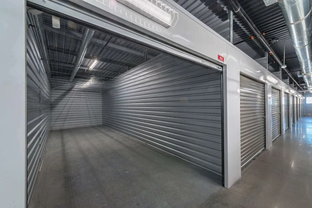 Indoor storage units with roll-up doors at Frisco Self Storage.